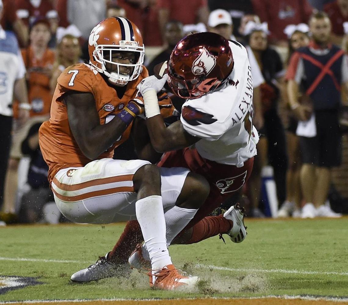 Louisville cornerback Jaire Alexander (right) and Clemson wide receiver Mike Williams fight for the ball in the end zone in last year’s ACC game at Clemson. Alexander, who grew up in Charlotte, ripped the ball away for an interception.