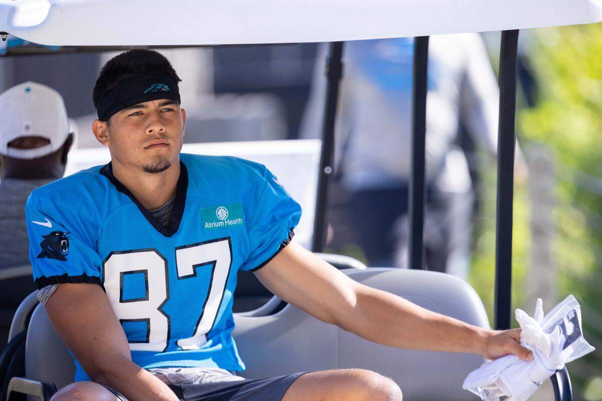 Carolina Panthers wide receiver Brycen Tremayne rides up to practice during training camp. 