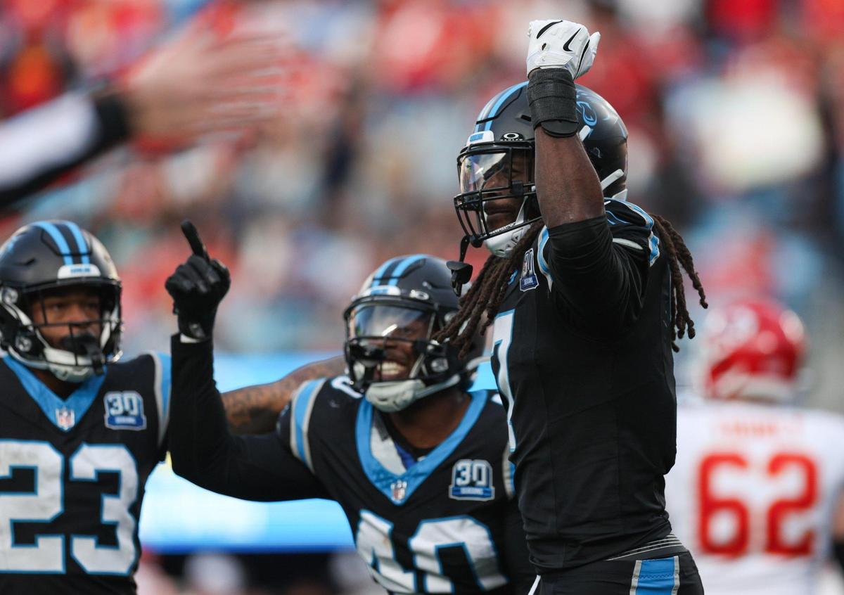 Panthers outside linebacker Jadeveon Clowney, right, celebrates with teammates after a quarterback sack during the game against the Chiefs at Bank of America Stadium in Charlotte, NC on Sunday, Nov. 24, 2024.