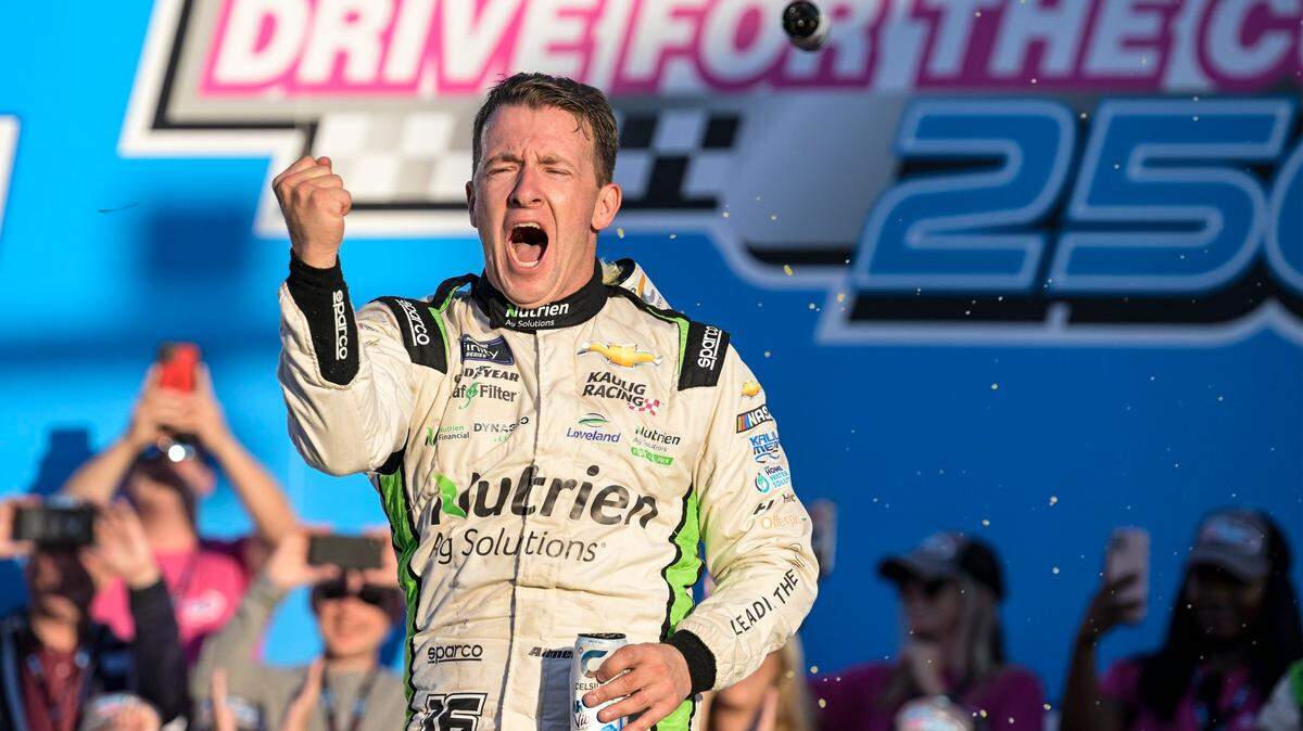 AJ Allmendinger celebrates in Victory Lane after winning the NASCAR Xfinity auto race at Charlotte Motor Speedway on Saturday, Oct. 8, 2022, in Concord, N.C. (AP Photo/Matt Kelley)