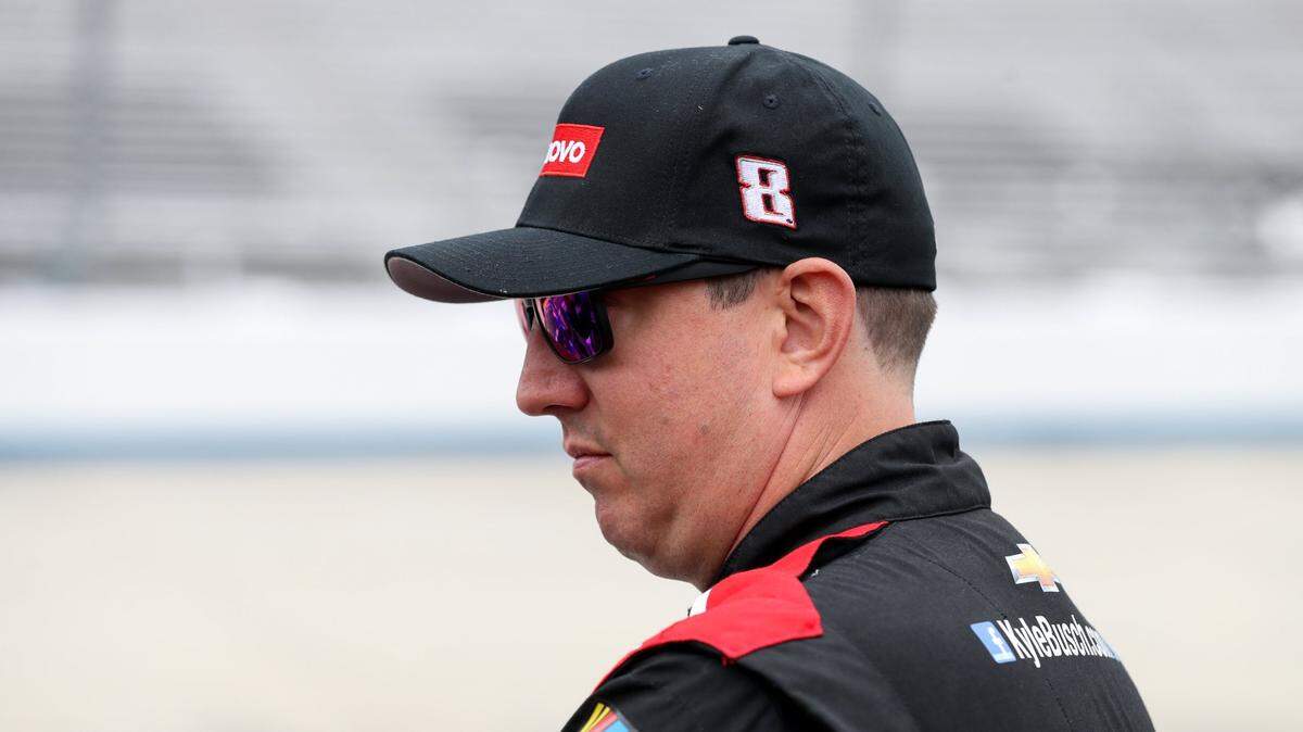 Apr 29, 2023; Dover, Delaware, USA; NASCAR Cup Series driver Kyle Busch stands behind the pit road wall during practice and qualifying for the Wurth 400 at Dover Motor Speedway. Mandatory Credit: Matthew OHaren-USA TODAY Sports