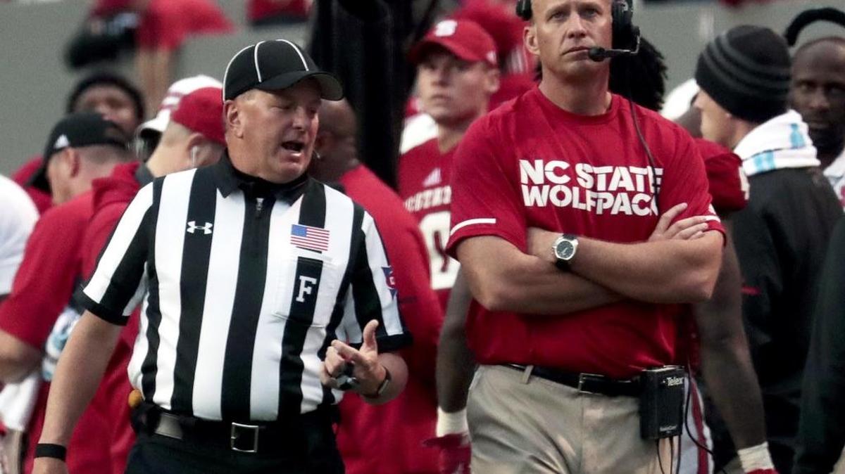 N.C. State head coach Dave Doeren doesn't seen pleased with an officials explanation on a play during the third quarter of an ACC college football game between the N.C. State Wolfpack and the Clemson Tigers played at Carter-Finley Stadium in Raleigh, NC on Saturday, Nov. 4, 2017. Clemson beat N.C. State 38-31.