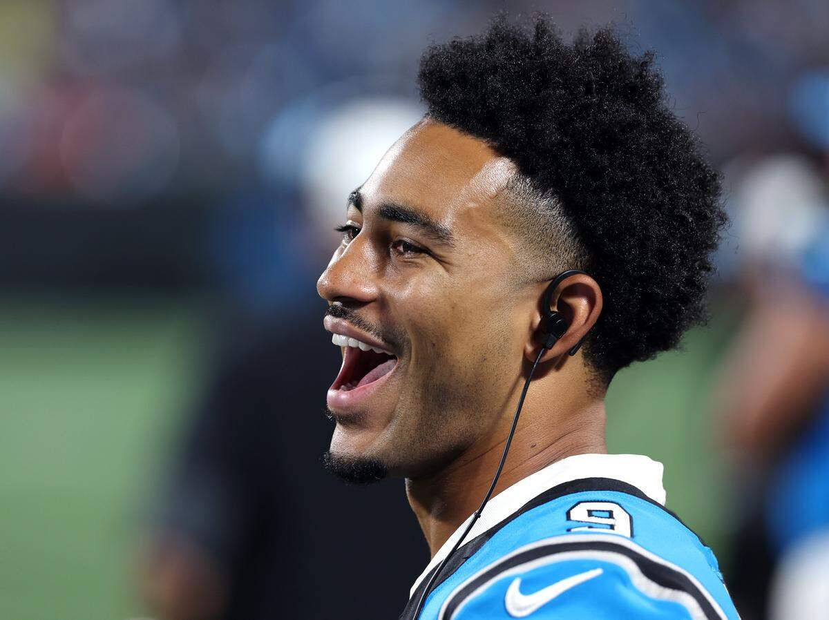 Carolina Panthers quarterback Bryce Young talks with a teammate along the team's sideline during action against the Cleveland Browns on Friday, August 8, 2025 at Bank of America Stadium in Charlotte, NC. The Browns defeated the Panthers 30-10.