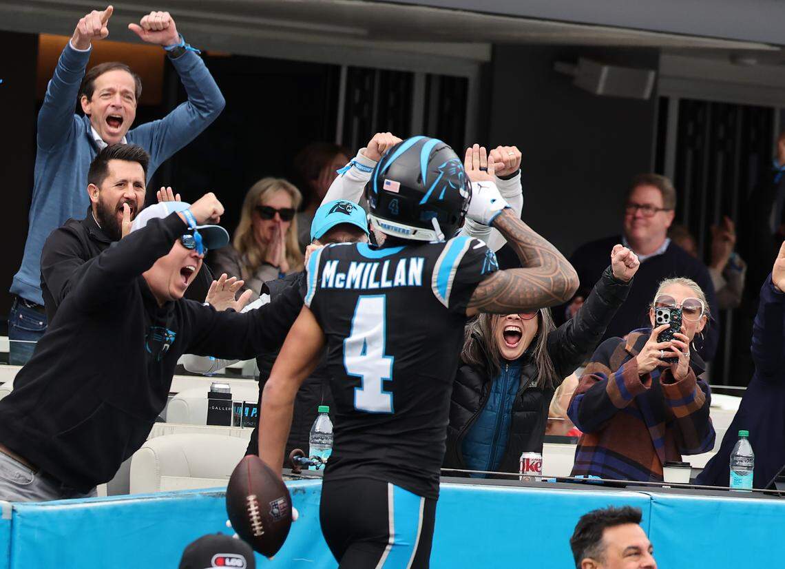 Carolina Panthers Tetairoa McMillan celebrates with fans after scoring a touchdown Sunday at Bank of America Stadium in Charlotte