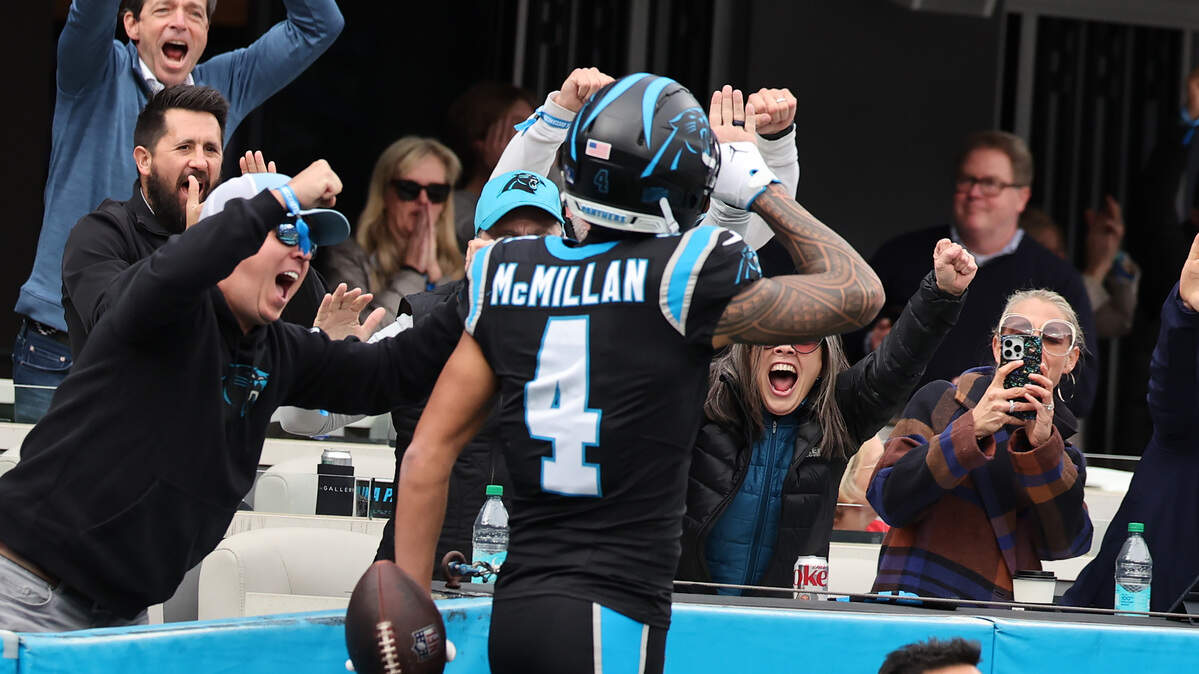 Carolina Panthers Tetairoa McMillan celebrates with fans after scoring a touchdown Sunday at Bank of America Stadium in Charlotte