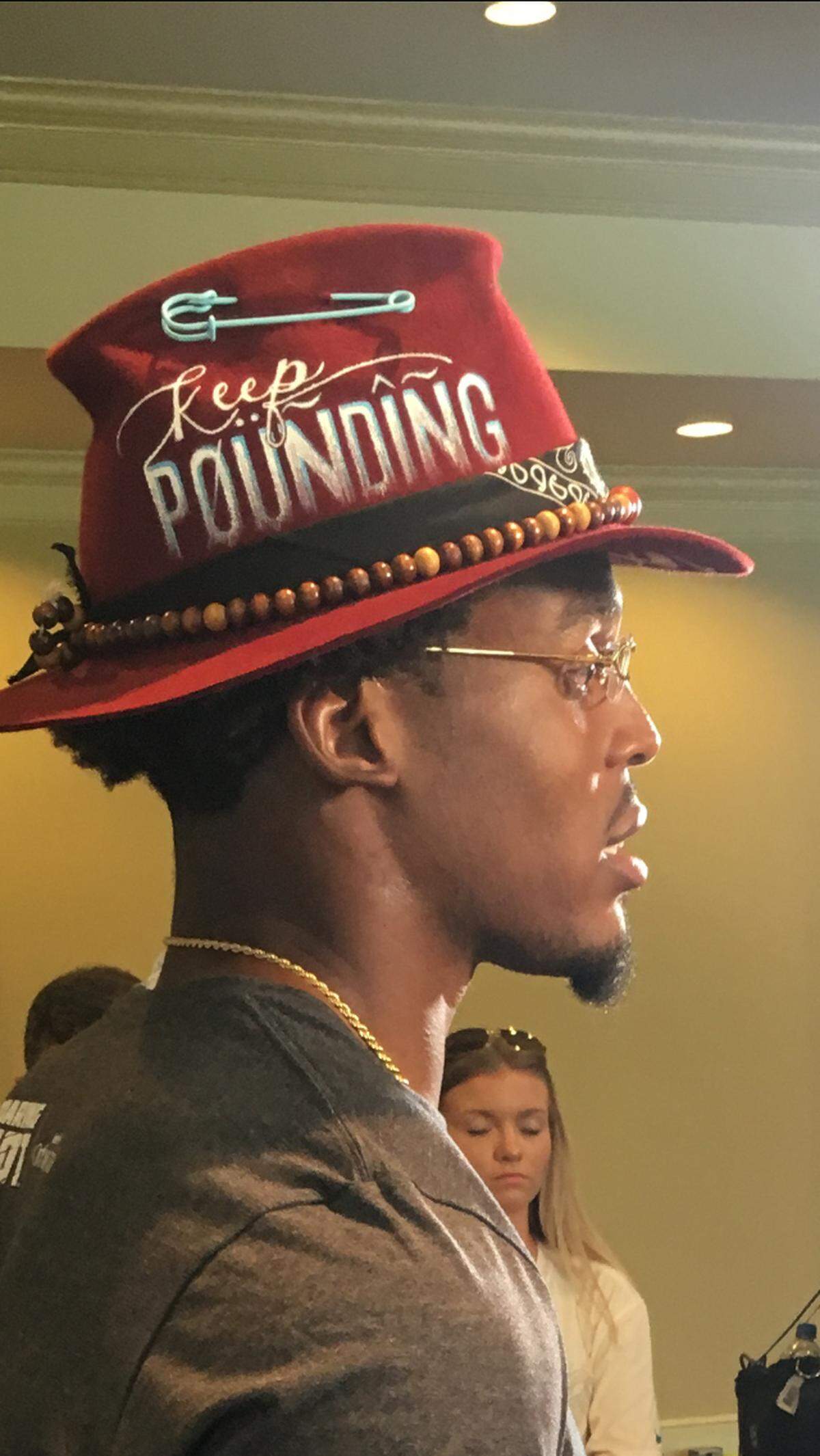 Carolina Panthers quarterback Cam Newton wore a burgundy hat with the Panthers motto “Keep Pounding” stitched into it Saturday for his first press conference of the 2018 season.