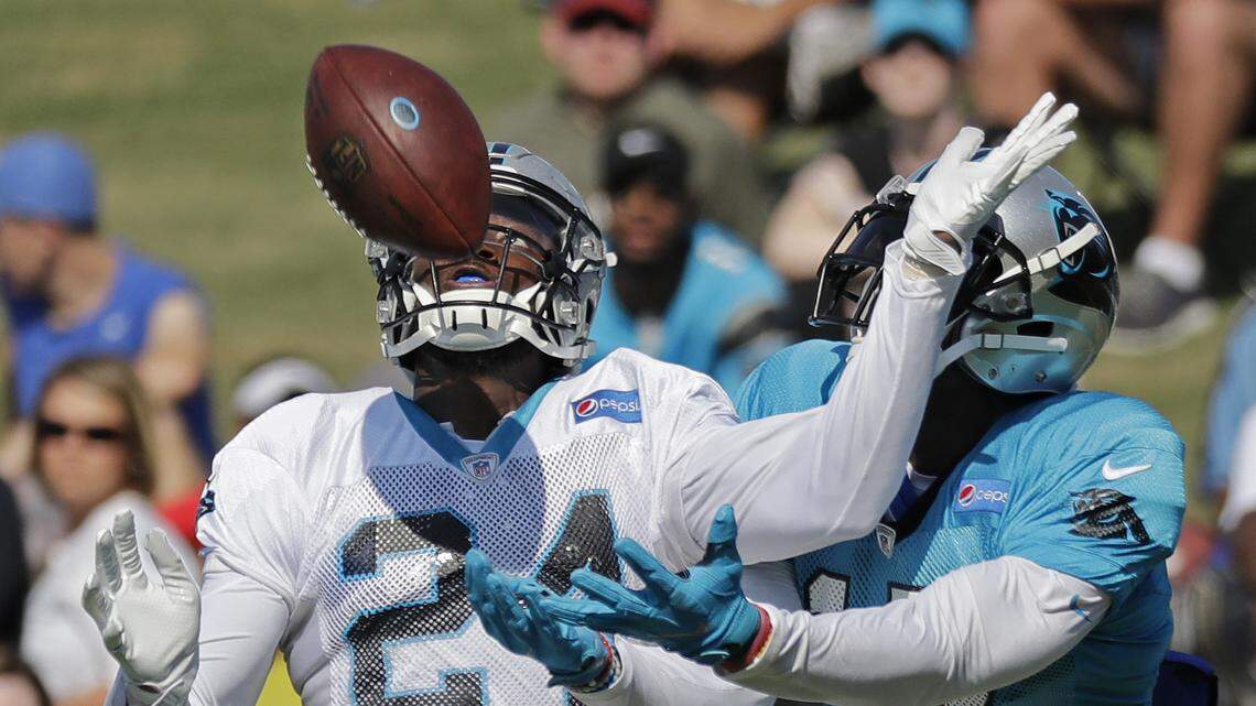 Carolina Panthers’ James Bradberry (24) defends against Devin Funchess (17) during an NFL football practice at the team’s training camp in Spartanburg, S.C., Saturday, July 28, 2018. (AP Photo/Chuck Burton)