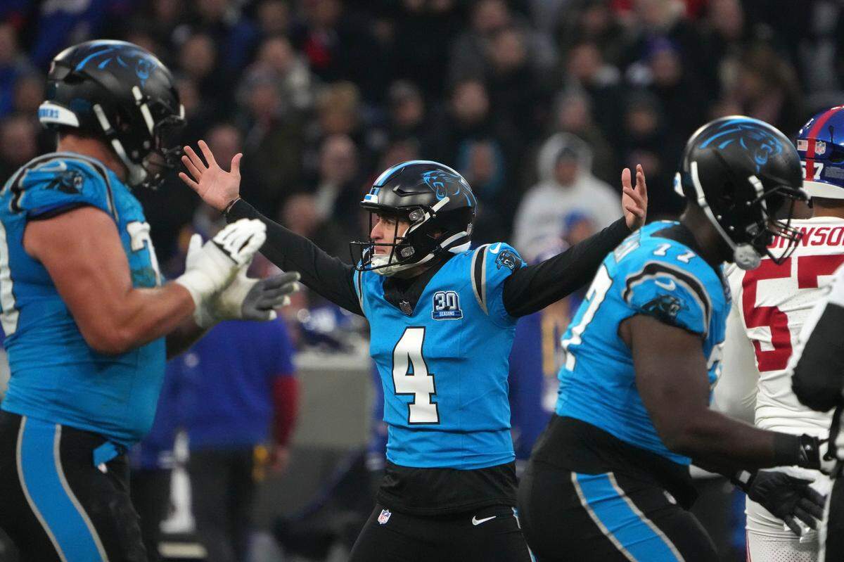 Carolina Panthers place kicker Eddy Pineiro (4) celebrates after kicking a 53-yard field goal against the New York Giants in the first half during the 2024 NFL Munich Game at Allianz Arena.