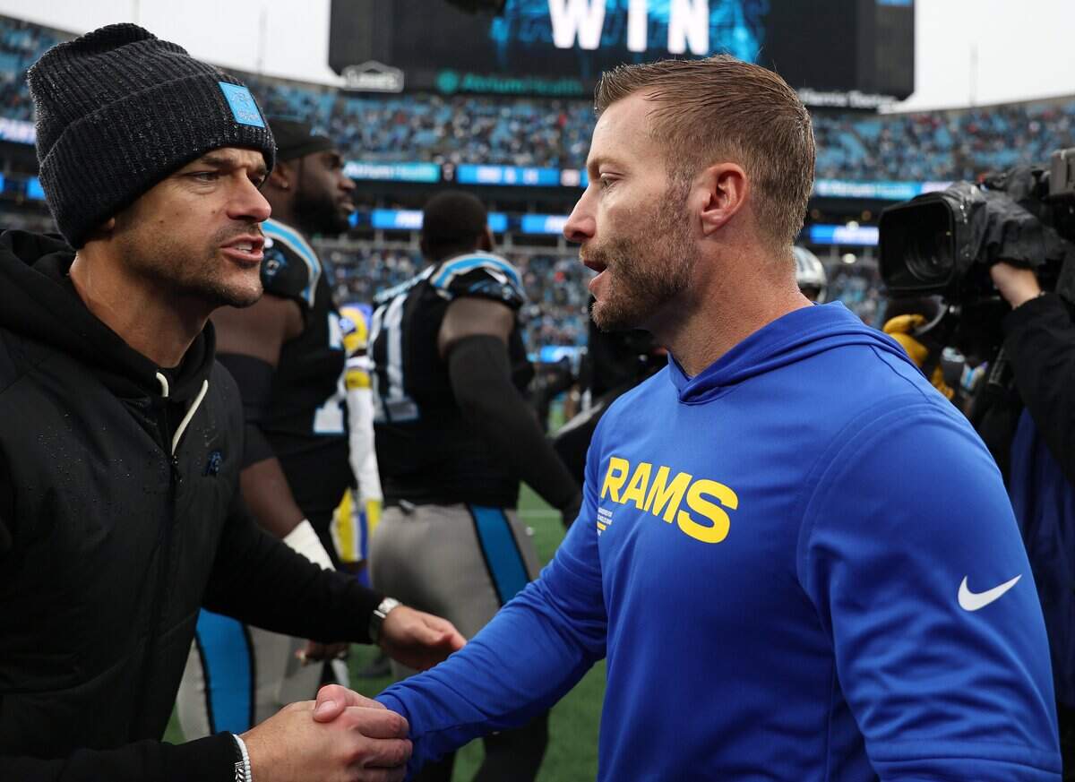 Head coaches Dave Canales of the Carolina Panthers and Sean McVay of the Los Angeles Rams shake hands following the game at Bank of America Stadium on Nov. 30, 2025, in Charlotte, North Carolina.