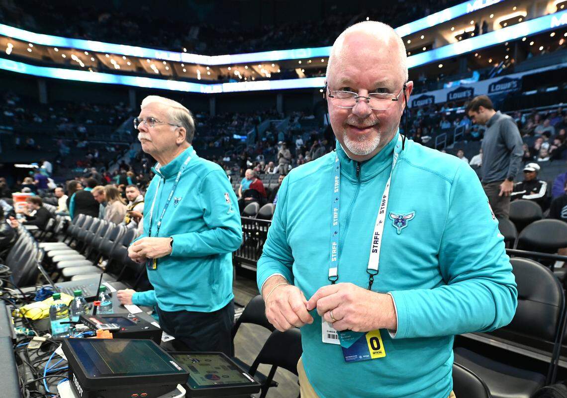 Charlotte Hornets longtime official scorer Michael Harwood, right, on Monday, March 3, 2025 at Spectrum Center in Charlotte, NC. The Hornets hosted the Golden State Warriors in NBA action on Monday.